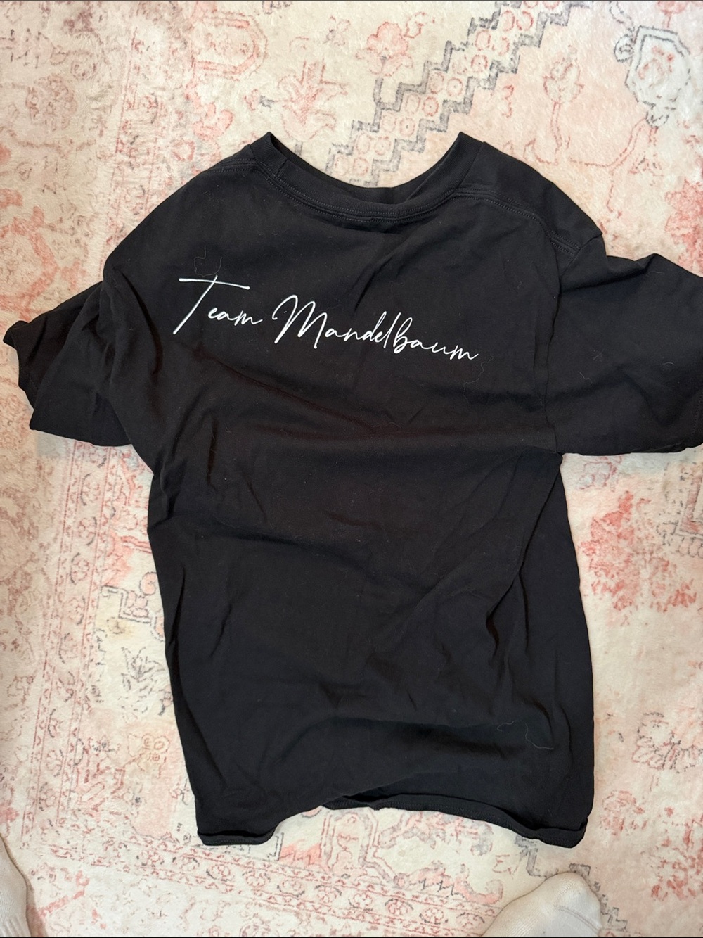 Source Unknown Black Tee with 'Team Mandelbaum' Script
